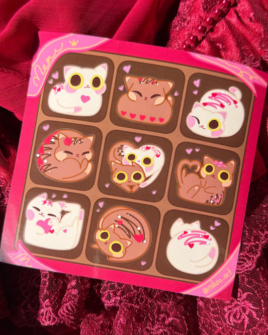 Chocolate bar with cartoon cat designs on a red fabric background